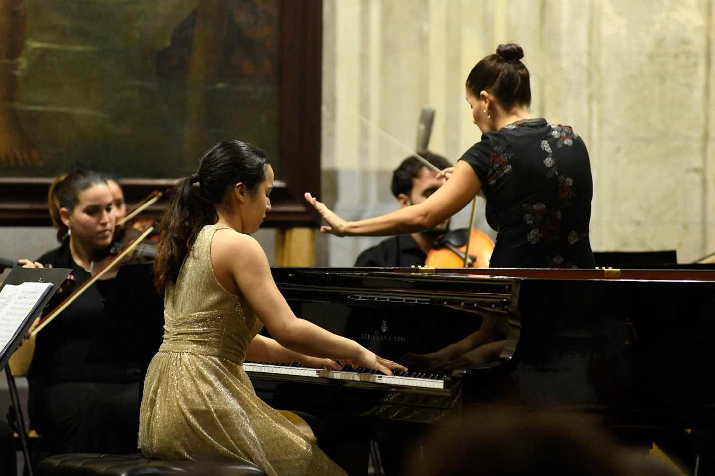 Leah Gavilan performing a concerto with orchestra.