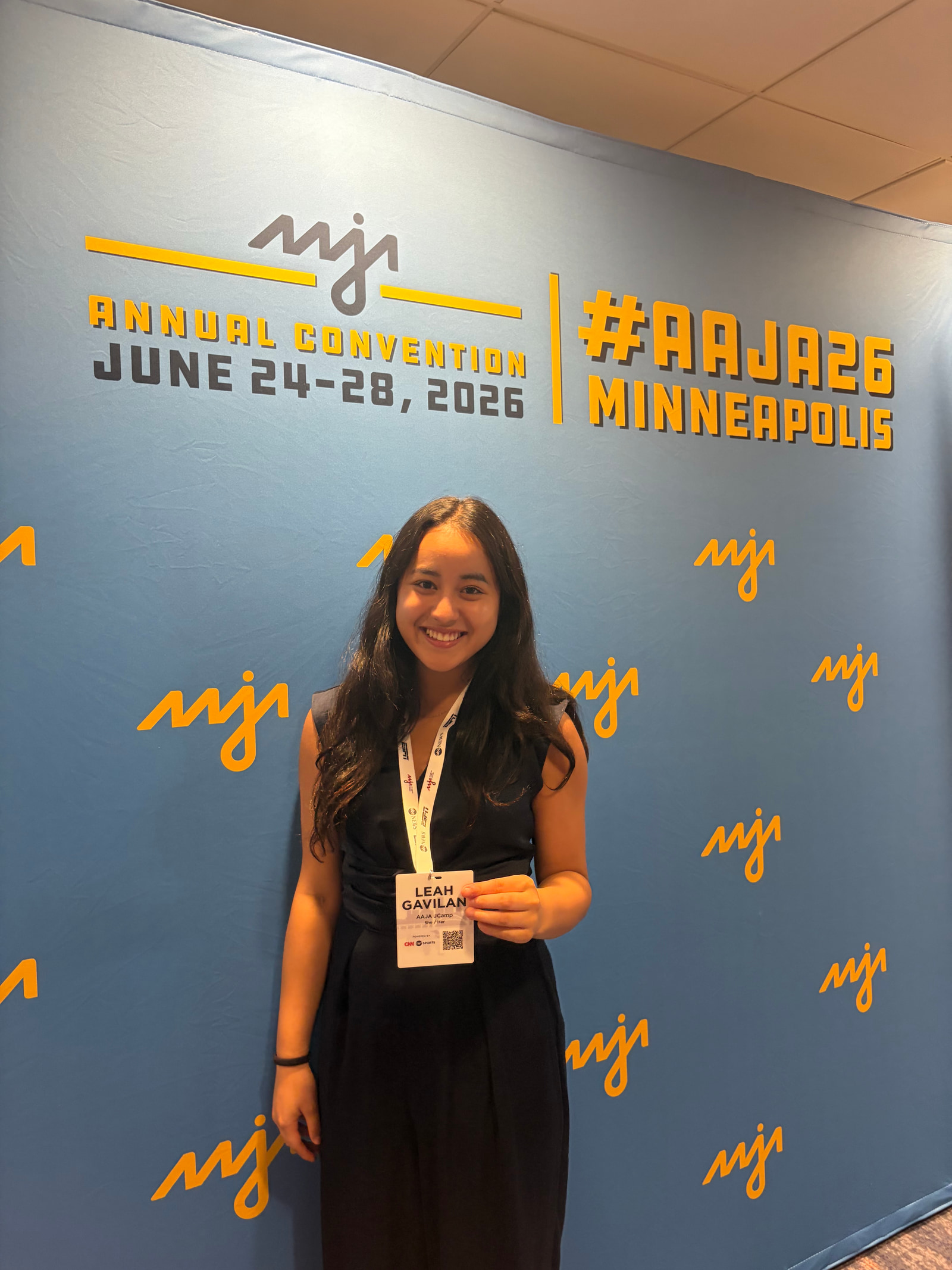 Leah Gavilan holding her JCamp badge at the AAJA annual convention in Minneapolis.